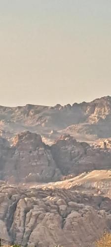 a view of a mountain covered in snow and clouds at Leen Guest House in Wadi Musa