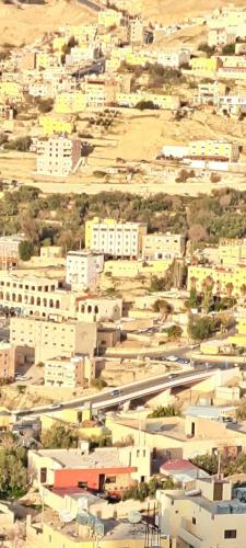 an aerial view of a city with buildings at Leen Guest House in Wadi Musa