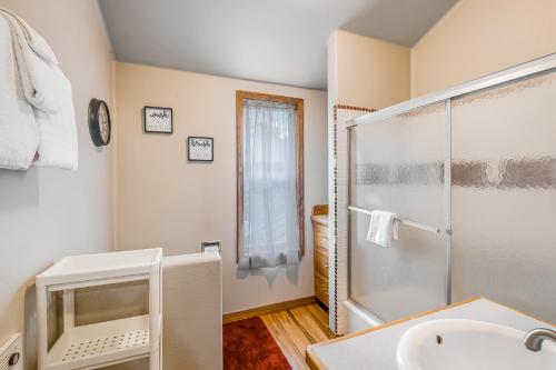 a bathroom with a shower and a sink at Port Susan Bay - A in Sunny Shore Acres