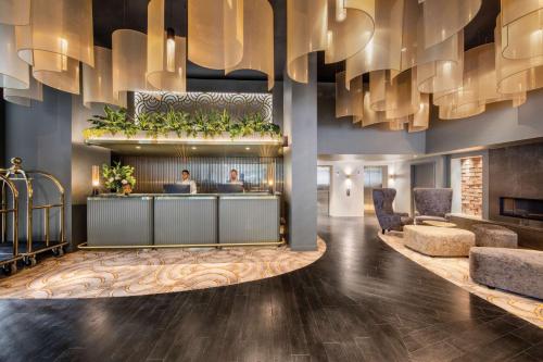 a lobby of a hotel with a reception desk at Vibe Hotel Hobart in Hobart