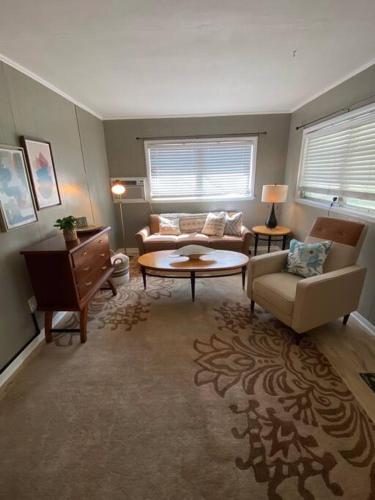 a living room with a couch and a table at Happy Days at Two Oaks in Lakeland