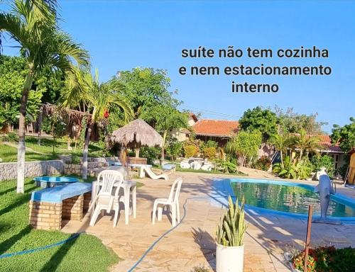 a villa with a swimming pool in a resort at Suites em Canoa Quebrada in Aracati