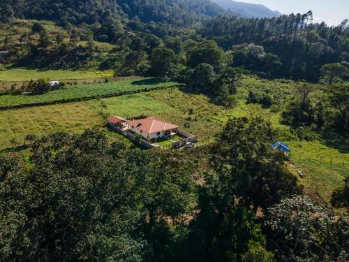 an aerial view of a house in a field at Sunflower village villa girasoles in Jarabacoa