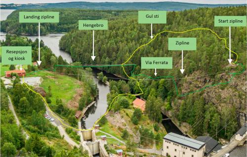 a map of a town with a river and forests at 2 Bedroom Cozy Home In Halden in Halden