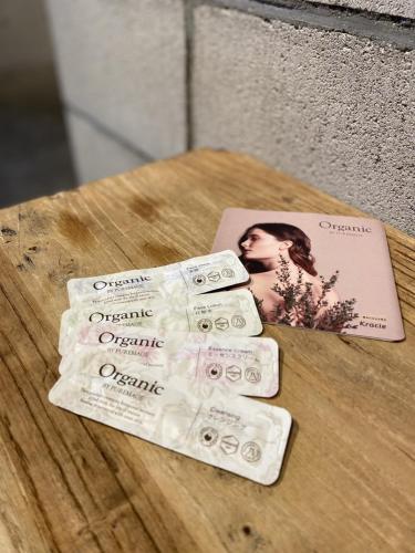 a group of four bottles of organic soap on a table at Kawasaki King Skyfront Tokyu REI Hotel in Kawasaki