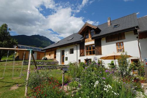 a house with a garden in front of it at Le Gite de Noemie in Mercury
