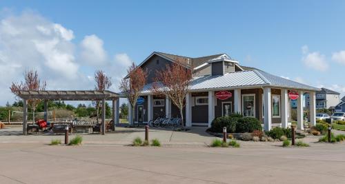 a building with a store on the side of a street at Sasquatch Shore House in Ocean Shores