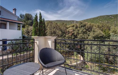 a pair of chairs sitting on a balcony with a view at Pet Friendly Home In Sveti Jakov in Sveti Jakov