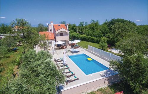 an aerial view of a house with a swimming pool at Stunning Home In Donji Zemunik With House A Panoramic View in Donji Zemunik
