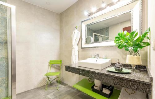 a bathroom with a sink and a mirror at Stunning Apartment In Sevilla With Wifi in Seville