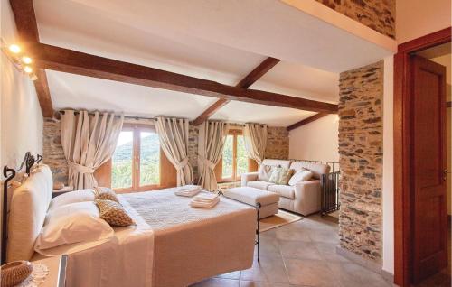 a living room with a bed and a couch at Casa Castelli in Garlenda