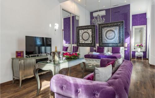 A television and/or entertainment centre at Amazing Apartment In Sevilla With Wifi