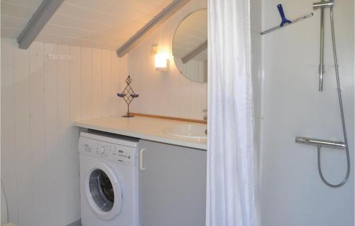 a washing machine in a bathroom with a sink at Two-Bedroom Holiday Home In Give in Give