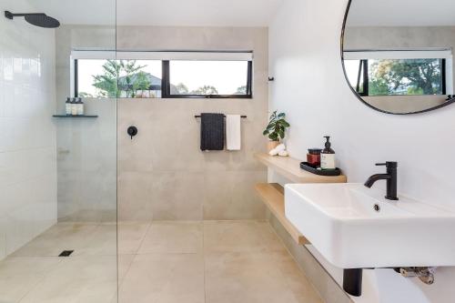 a bathroom with a sink and a shower at The Lookout, Eagle Bay in Dunsborough