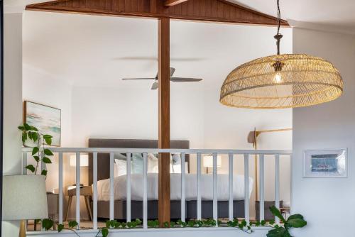 a bedroom with a crib and a pendant light at The Lookout, Eagle Bay in Dunsborough