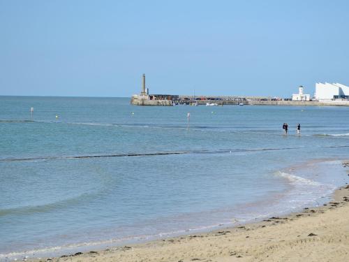 two people standing in the water at the beach at Apartment 12 - Uk42743 in Whitstable