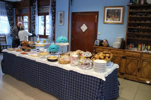 a table with food on it in a room at Hotel Garona in Bossost