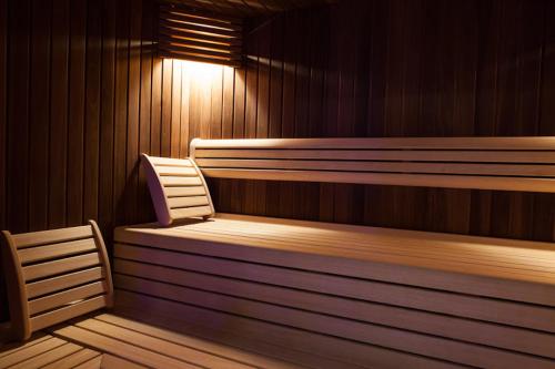a sauna with a bench and a light in it at Hotel 4 Venti spa & wellness in Sestri Levante