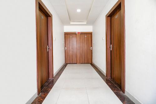 an empty corridor with two doors at FabExpress Comfort Stay I in Bhopal