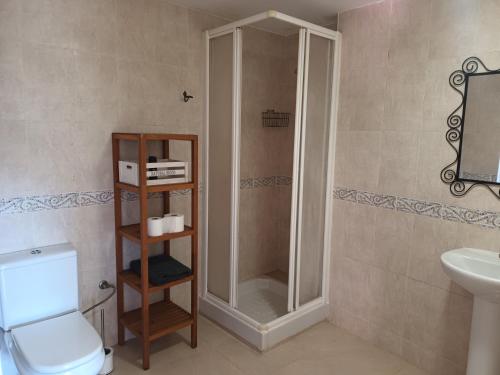 a bathroom with a shower and a toilet and a sink at 1 La Cala Palamós in Palamós