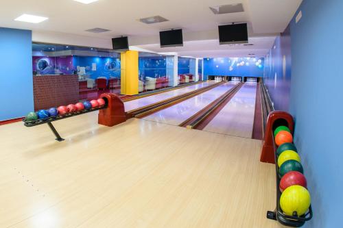 a bowling alley with pins on the lanes at Hotel Magnus Trenčín in Trenčín