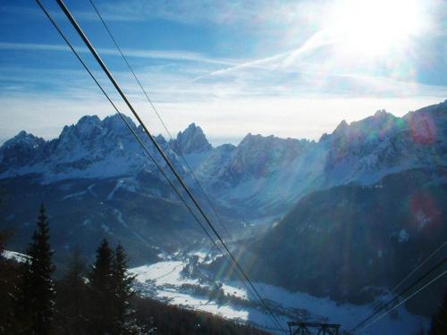 a gondola ride over a snow covered mountain at Bachlaufen Haus in Sesto