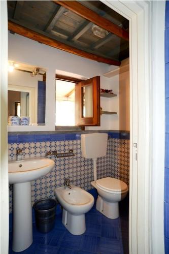 a bathroom with a sink and a toilet in it at Residence il Baglio in Porto San Giorgio