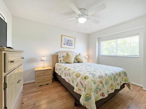 a bedroom with a bed and a ceiling fan at Ainsdale Haven home in Kissimmee