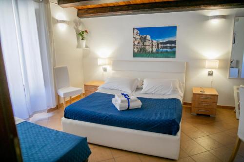 Postel nebo postele na pokoji v ubytování Cefalu in Blu
