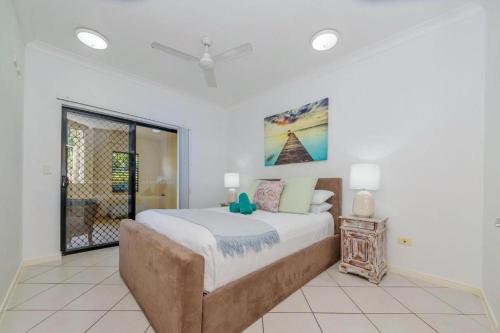 a bedroom with a large bed and a window at Breakwater 16 in Townsville