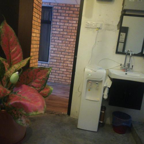 a small bathroom with a sink and a sink at Myera Hotel in Banting