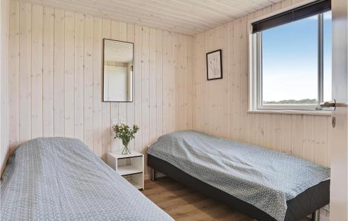 a bedroom with two twin beds and a window at Lovely Home In Spttrup With Sauna in Lem