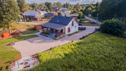 an aerial view of a white house with a roof at Pasieka Podlaska Tradycja in Siemiatycze