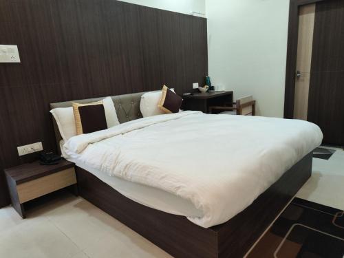 Katil atau katil-katil dalam bilik di Hotel Green Apple