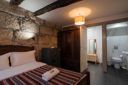 Кровать или кровати в номере Casa da Hera - The Ivy House