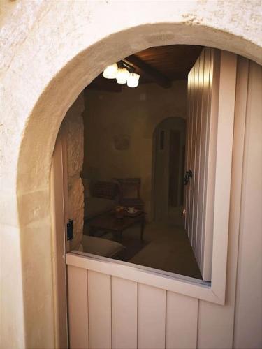 a room with a large mirror on the wall at Casa Opuntia in Pappayiannádhes