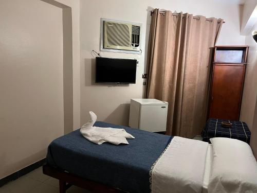 Postel nebo postele na pokoji v ubytování Anglo Hotel