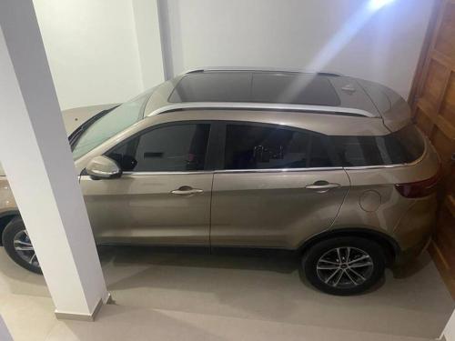 a silver car is parked in a room at Chicama D'Amore - Family Place & Wave Paradise - Parking & kidszone - on Puerto Chicama in Puerto Chicama