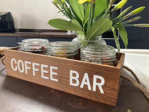 a crate with a sign that says coffee bar at Lime Tree Cottage in Tillingham