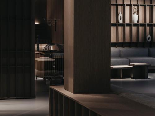 a living room with a couch and a table at Haven Mountain Retreat in Sankt Johann im Pongau