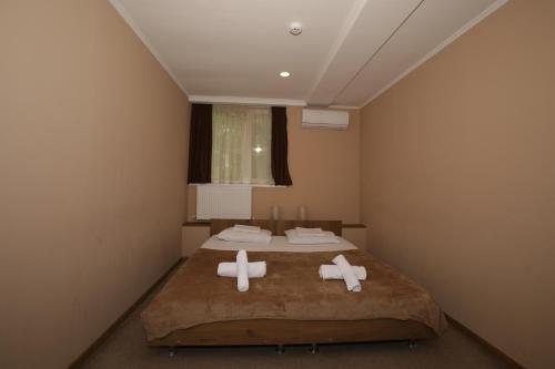 Postel nebo postele na pokoji v ubytování Hotel Reverence