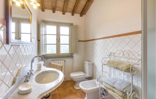 a bathroom with a sink and a toilet at Lovely Home In Camaiore Lu With Outdoor Swimming Pool in Montemagno