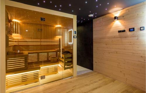 a room with a sauna with a wooden wall at Cozy Home In Brod Na Kupi With Kitchen in Brod na Kupi