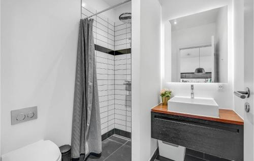 a bathroom with a sink and a shower at Amazing Home In Strby With House Sea View in Strøby