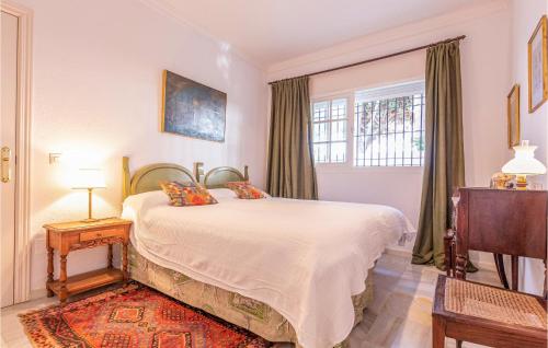 a bedroom with a bed and a window at Awesome Home In Marbella With Wifi in Marbella
