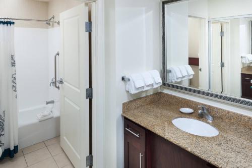 a bathroom with a sink and a mirror at Residence Inn by Marriott Franklin Cool Springs in Franklin