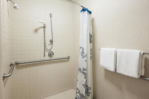 a bathroom with a shower with a shower curtain at Residence Inn Boston Marlborough in Marlborough