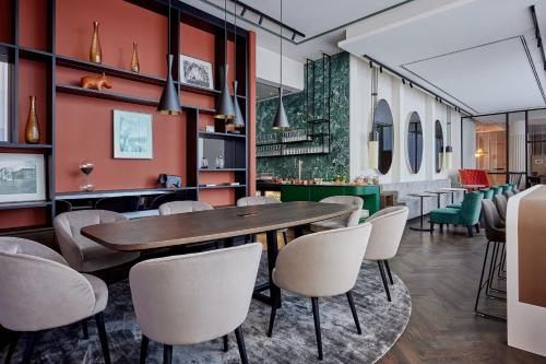 a dining room with a table and chairs at Basel Marriott Hotel in Basel