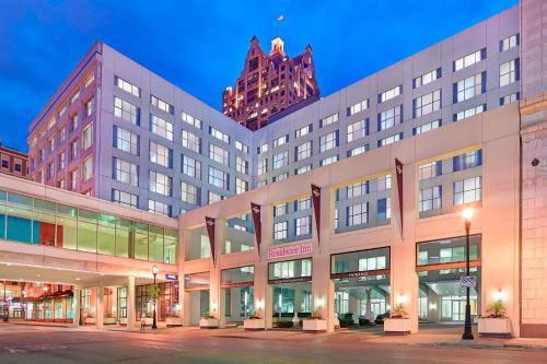 a large building on a city street at night at Residence Inn Milwaukee Downtown in Milwaukee