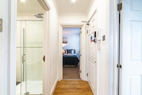 a hallway with a shower and a bedroom at Greyfriars in Clacton-on-Sea